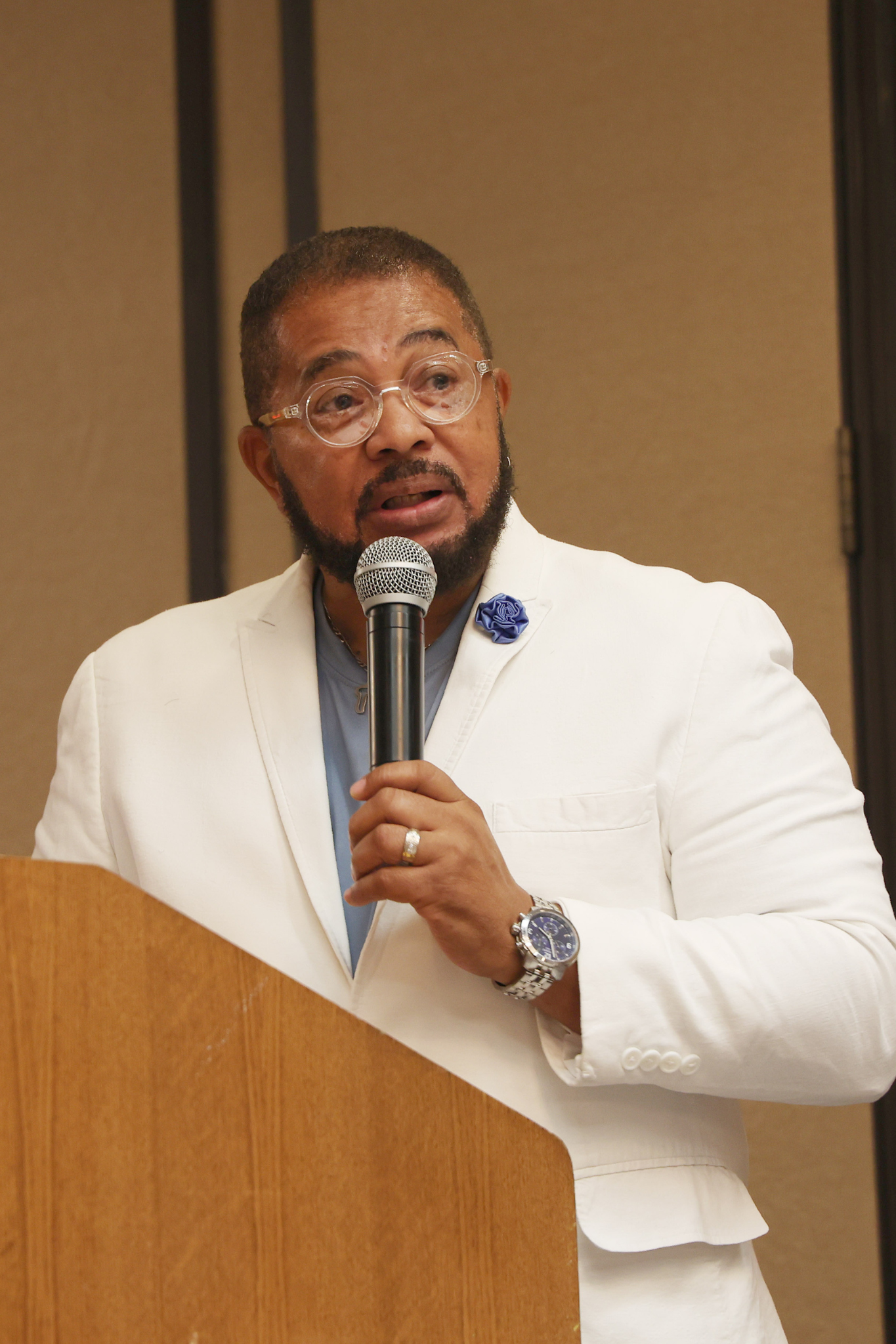 Dr. George Bell speaking at podium