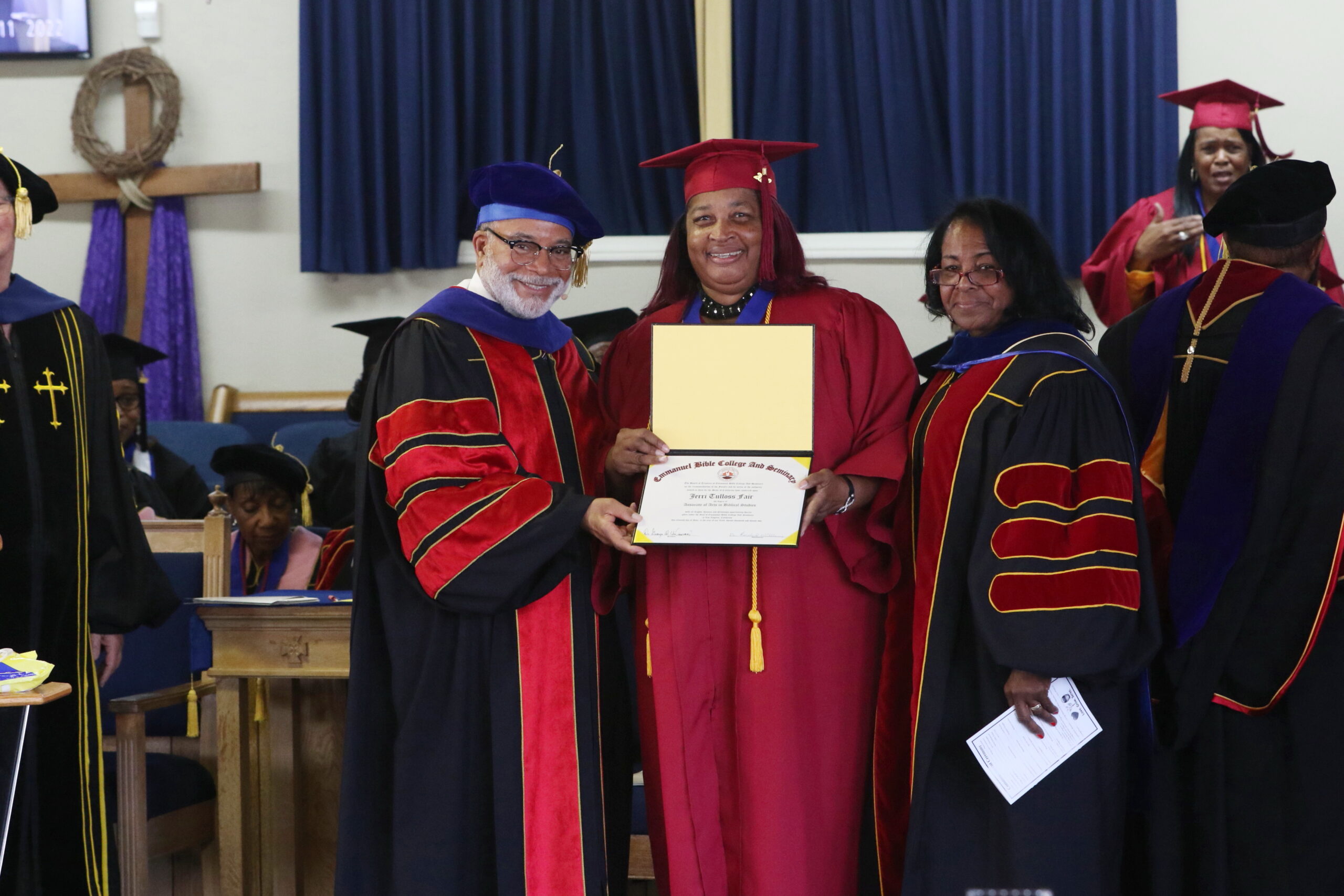 dr underwood and teacher pictured with graduate