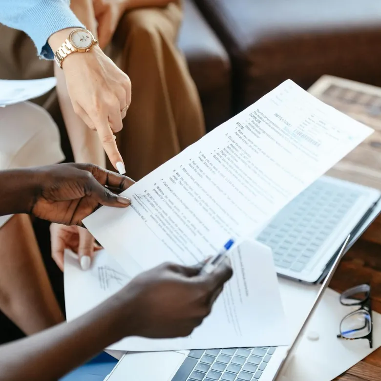 person holding a document up