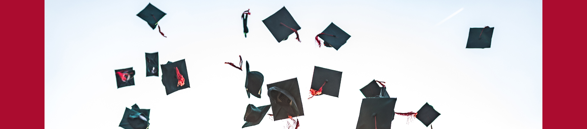 graduation caps thrown in air