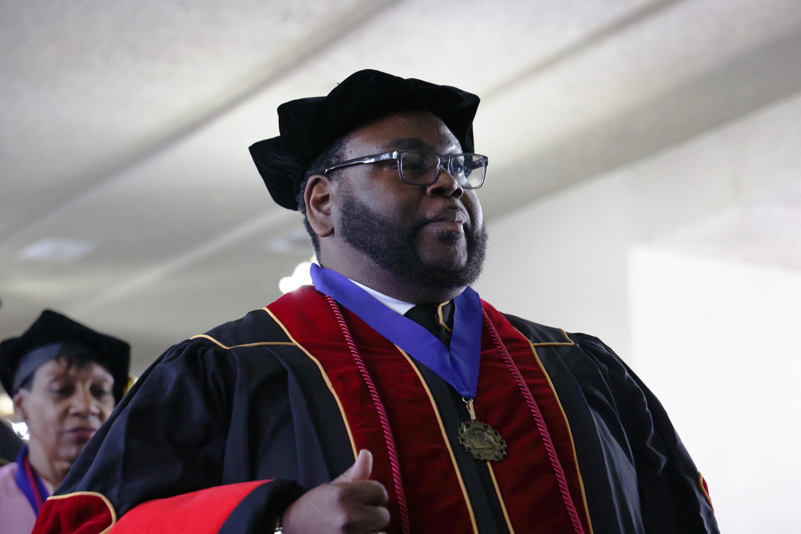 man in graduation cap and gown