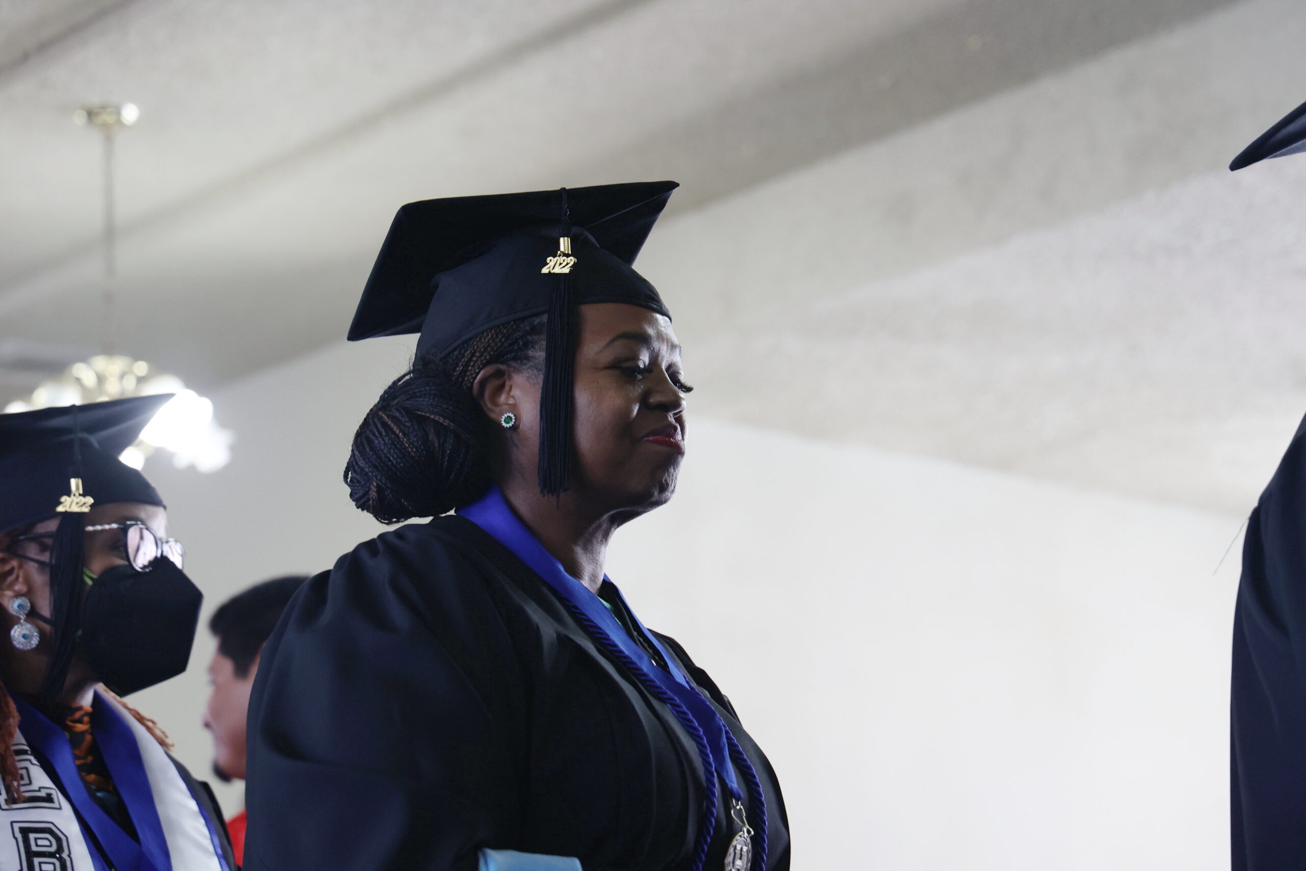 woman in graduation cap and gown