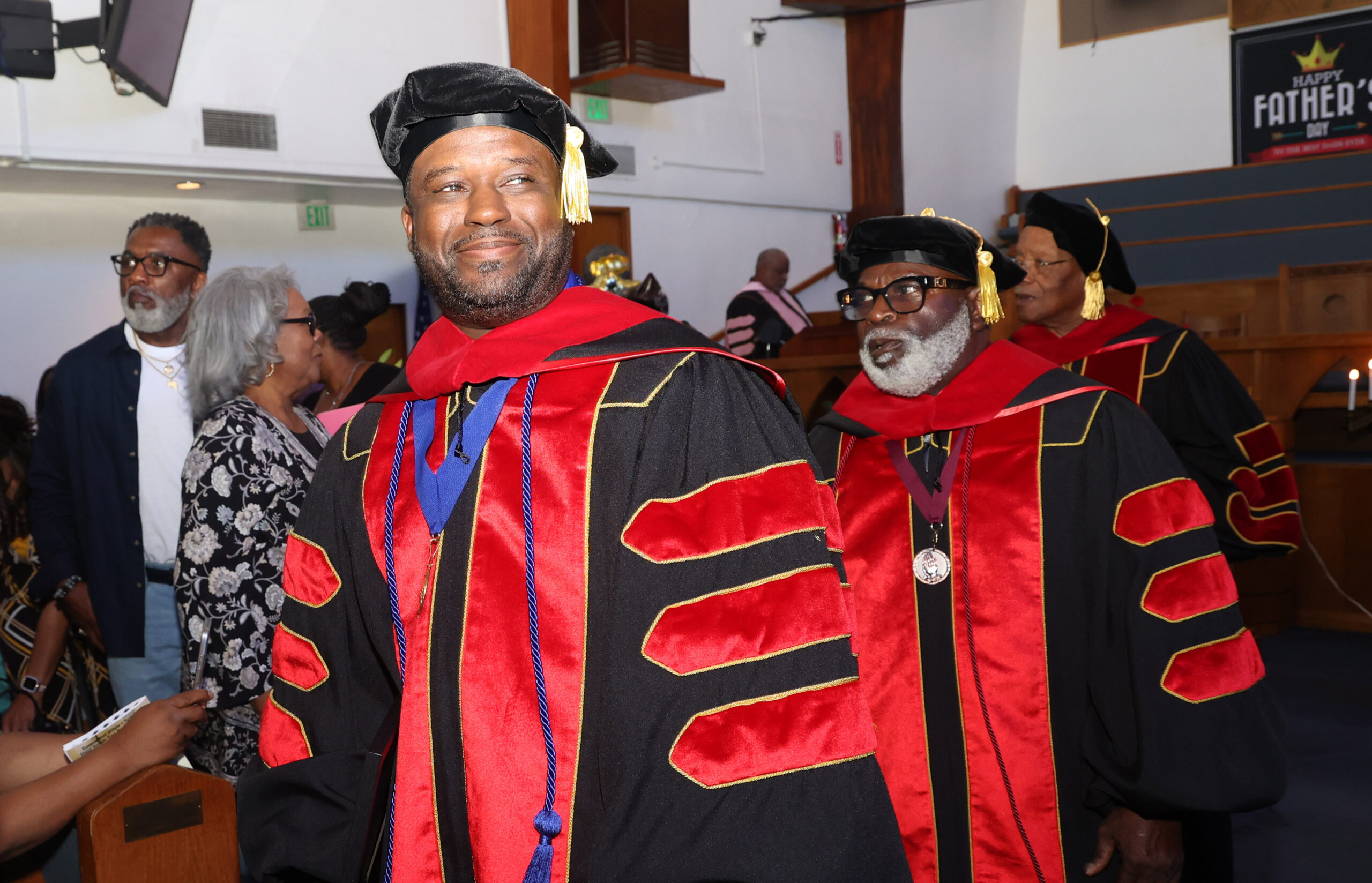 man with doctorate regalia on