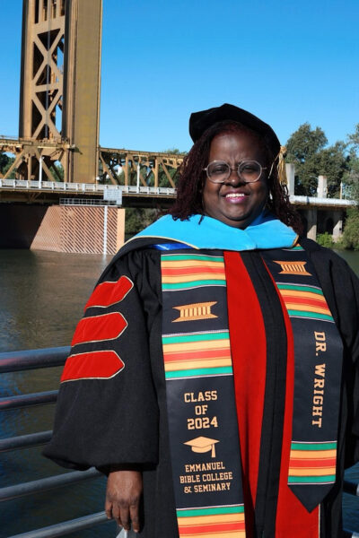 lady with doctorate degree regalia on