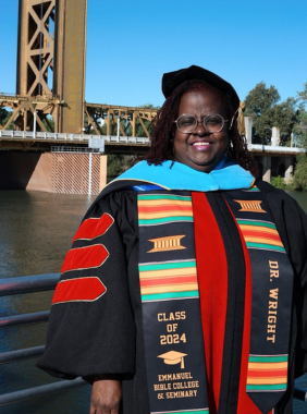 lady with doctorate degree regalia on